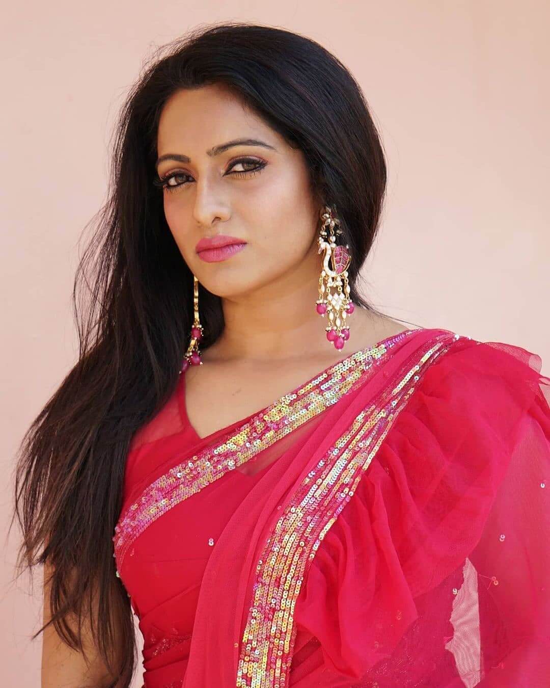 Udaya bhanu attended an event wearing a pink net saree that has ruffles at ...