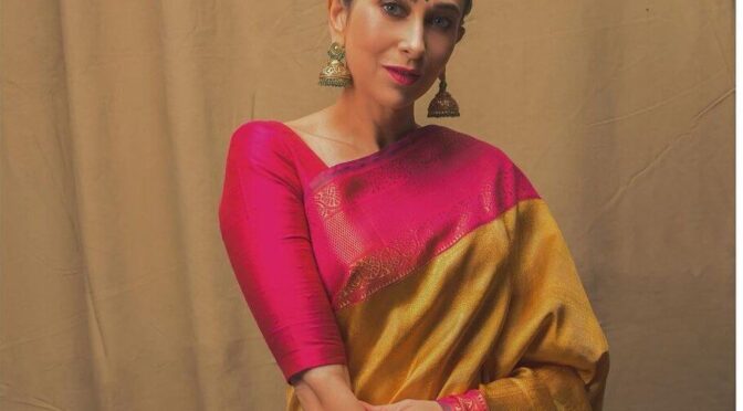 Karisma Kapoor in a mustard yellow Kanchipuram saree for a shop inauguration!