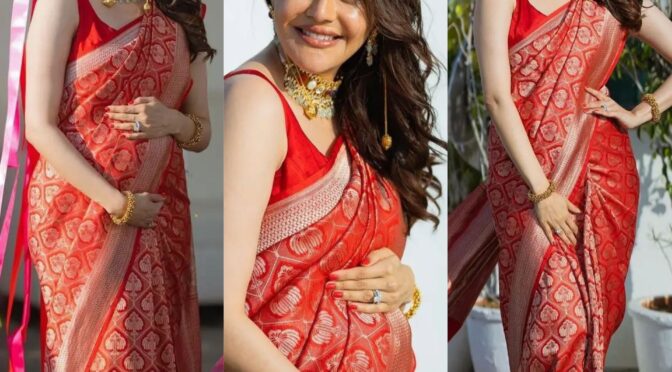 Kajal Aggarwal flaunts her baby bump in a red benerasi silk saree!