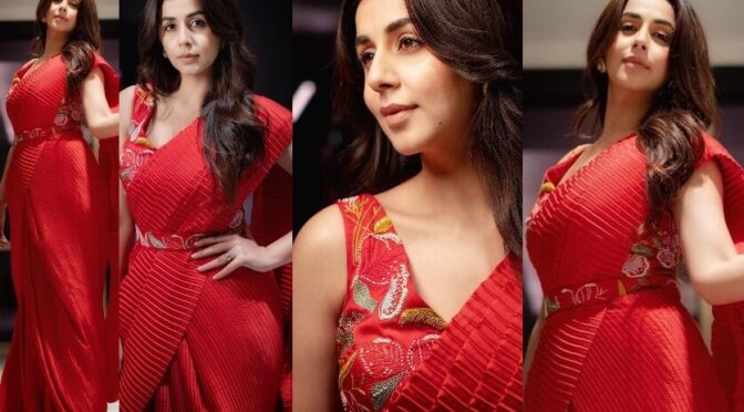 Nikki Galrani’s in a red crushed pre-draped saree with a belt!