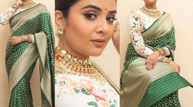 Sreemukhi looks beautiful in a green benarasi saree with full sleeves floral blouse!